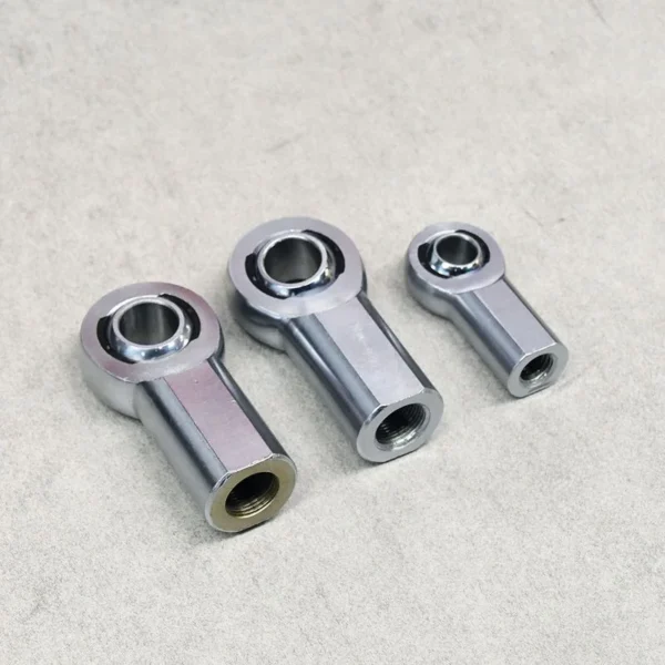 Three different-sized female thread rod ends for suspension applications.
