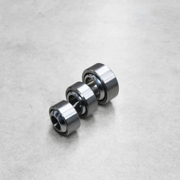 Three uniball bearings showcasing different sizes and designs.