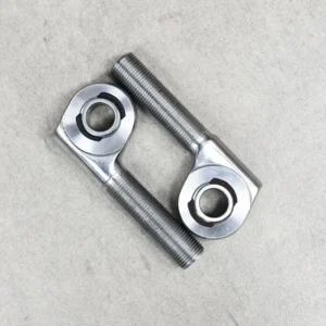 A pair of crossed offset rod ends for enhanced suspension geometry.