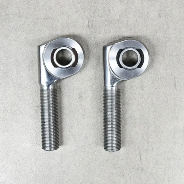 A pair of offset rod ends designed for suspension and steering adjustments.