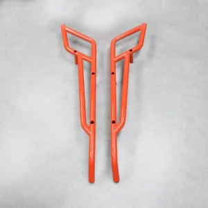 A pair of orange-colored nerf bars designed for the Can-Am Maverick X3 for improved protection and performance.