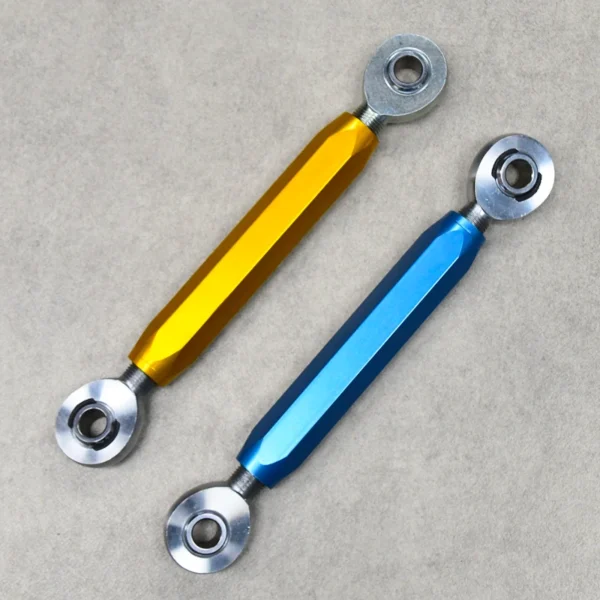A yellow and a blue sway bar link designed for suspension stability and control.