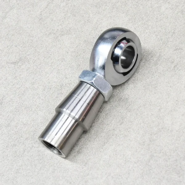 Side view of a rod end kit with tube adapter and jam nuts for suspension systems.