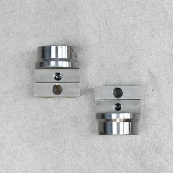 Two tube couplers designed for off-road suspension and steering assemblies.