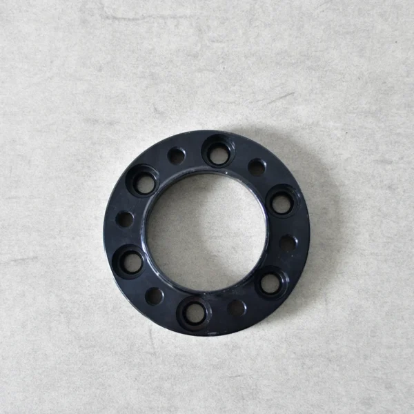 Black anodized aluminum 122 wheel spacers with 6x139.7mm bolt pattern, offering performance and durability.