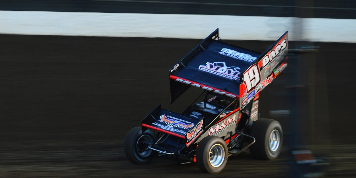 Sprint car racing on dirt oval track