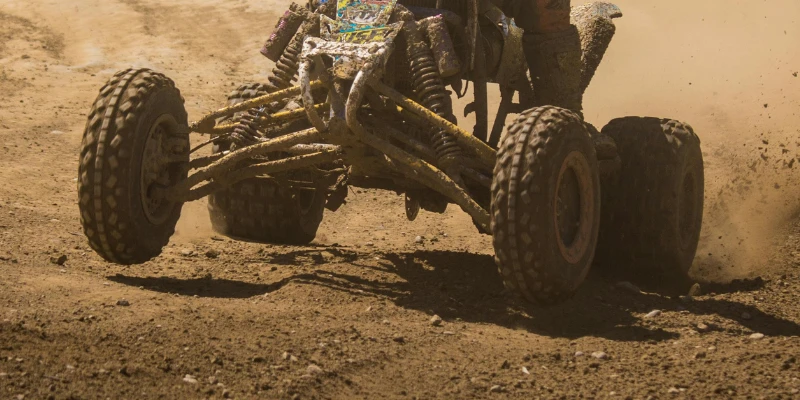 ATV showing negative camber on the front wheel.