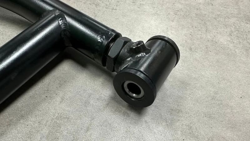 Close-up of A-arm pivot bushing.