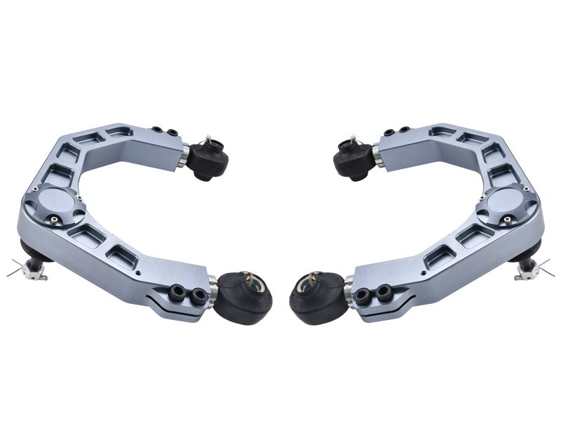 Two mirrored gray metal frames with black wheels at ends, arranged to form a near-circle on a white background.