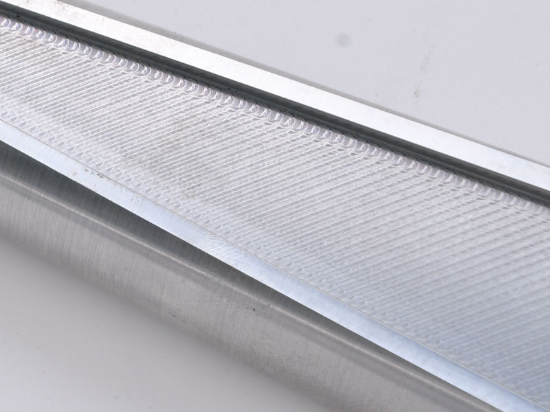CNC surface finish detail on a billet machined A-arm