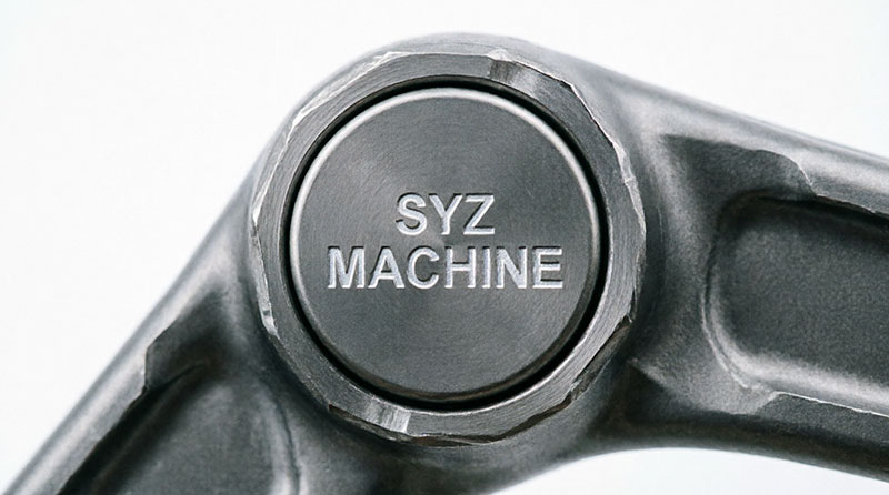 Laser logo branding detail on an A-arm