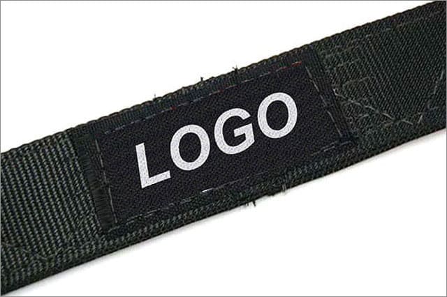 Black strap with a rectangular patch reading 'LOGO' in white letters, stitched along the edge to indicate branding.
