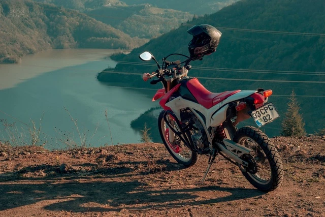 Adventure and dual-sport motorcycle for lowering links and suspension hardware programs